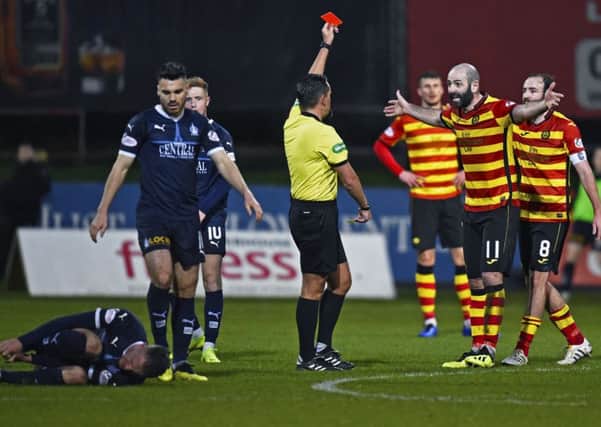 Partick Thistle's Gary Harkins protests his innocence after receiving a red card from referee Andrew Dallas. Picture: Rob Casey/SNS