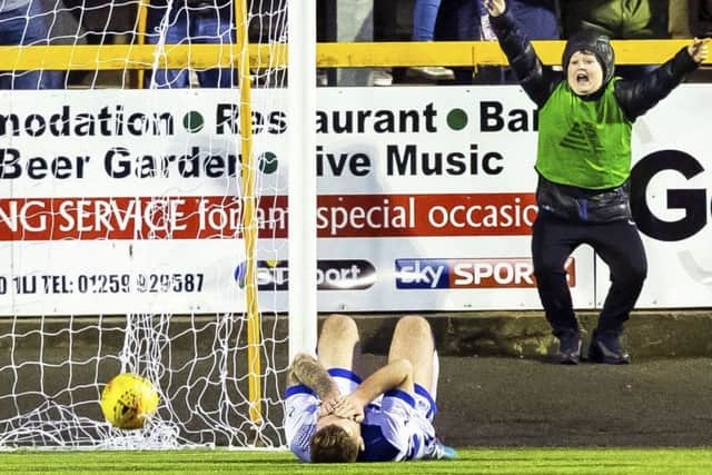 Kerr Waddell looks dejected after his clearance ended up in his own net to make it 2-1. Picture: SNS.