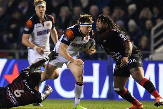Hamish Watson tries to drive past Toulon centre Mathieu Bastareaud. Picture: AFP/Getty