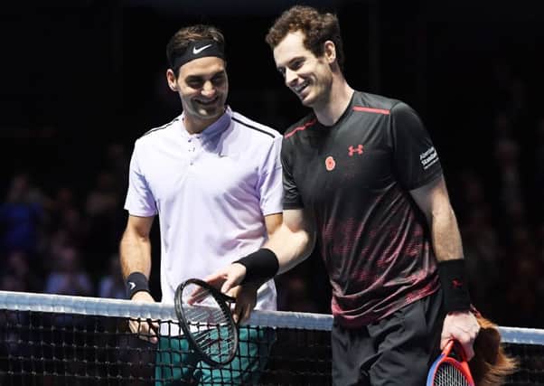 Andy Murray and Roger Federer share a joke at the end of a charity match in Glasgow in 2017. Picture: SNS