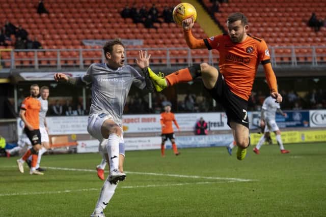 Dundee Uniteds Paul McMullan, right, battles with James Craigen. Picture: SNS.