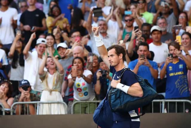 Andy Murray waves as he walks onto court prior to his first round match against Roberto Bautista Agut at Melbourne Park. Picture: Cameron Spencer/Getty Images