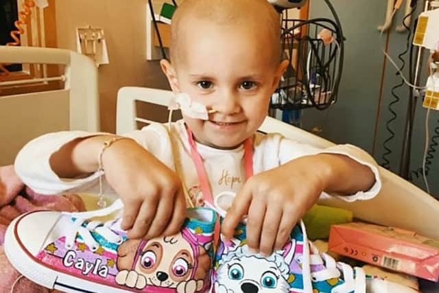 Little Cayla Jones is treated in hospital for stage 4 cancer - after initially going to her GP with stomach ache. Picture: SWNS