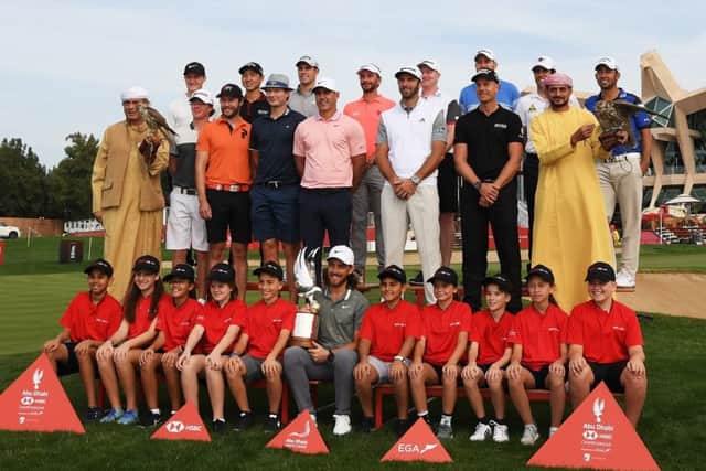 Tommy Fleetwood of England, Henrik Stenson of Sweden, Brooks Koepka of the United States, Dustin Johnson of the United States and members of the European Tour pose during a photocall at the Abu Dhabi Golf Club. Picture: Getty