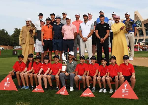 Tommy Fleetwood of England, Henrik Stenson of Sweden, Brooks Koepka of the United States, Dustin Johnson of the United States and members of the European Tour pose during a photocall at the Abu Dhabi Golf Club. Picture: Getty