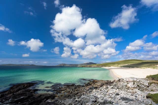 The turquoise waters of Luskentyre beach on the Isle of Harris, Outer Hebrides, Scotland, are a must see for travellers from around the world.