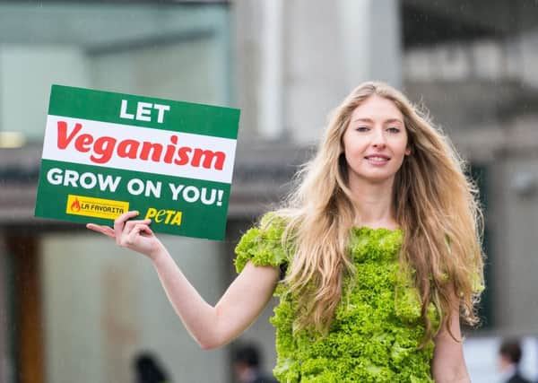Jenna McGuinness, wearing a dress made entirely of lettuce leaves, urges people to try a vegan diet outside the Scottish Parliament (Picture: Ian Georgeson)