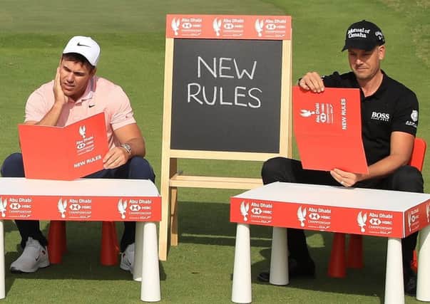 Brooks Koepka and Henrik Stenson get to grips with the new rules for 2019. Picture: Andrew Redington/Getty Images