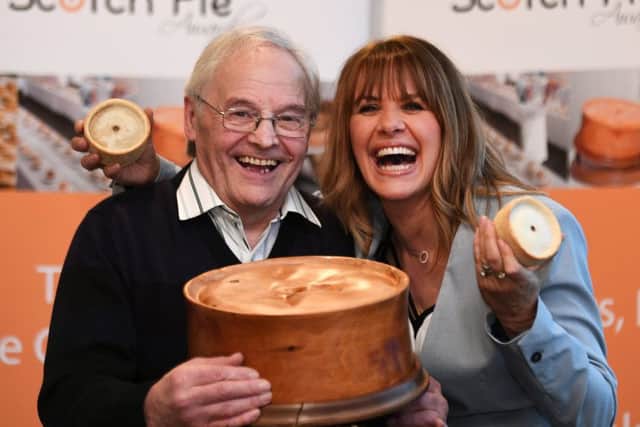 Carol Smillie presents winning baker Kerr Little of The Little Bakery with the 20th World Championship Scotch Pie Award. Picture: John Devlin