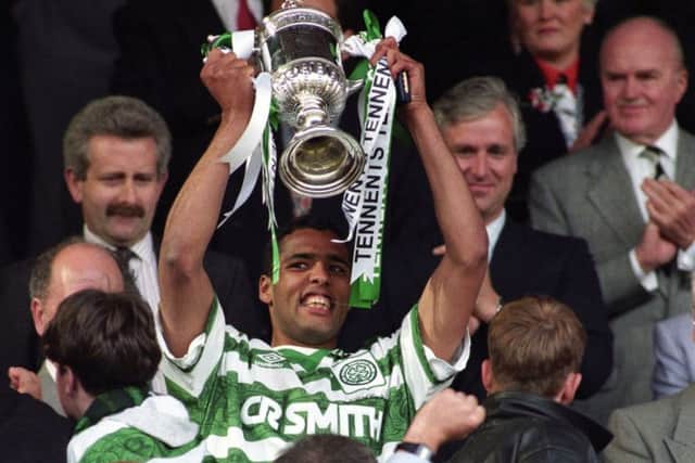 Pierre Van Hooijdonk lifts the Scottish Cup after Celtic's 1-0 win over Airdrie at Hampden in 1995.