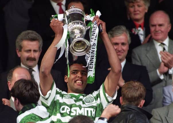 Pierre Van Hooijdonk lifts the Scottish Cup after Celtic's 1-0 win over Airdrie at Hampden in 1995.