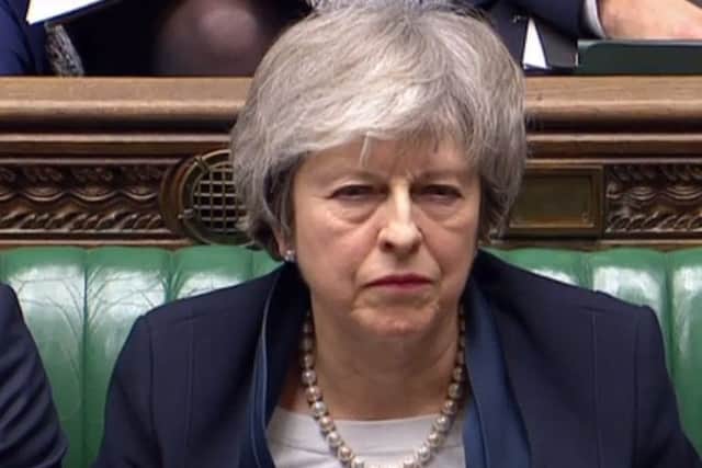 Bizarrely, The Scotsman is not calling for Theresa May's resignation despite the landslide defeat of her Brexit plan in the Commons (Picture: AFP/Getty)