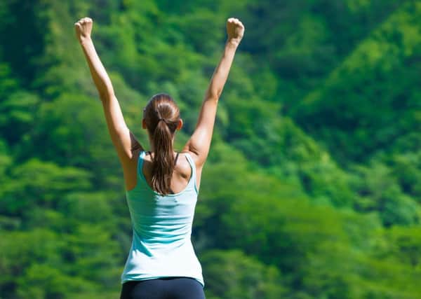 Woman celebrating her achieved goals.