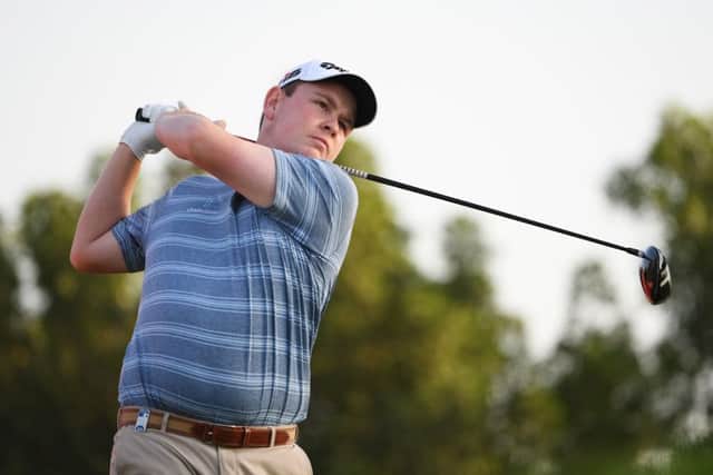 Bob MacIntyre tees off at the third on his way to a two-under 70 in the opening round of the Abu Dhabi HSBC Championship. Picture: Ross Kinnaird/Getty Inages