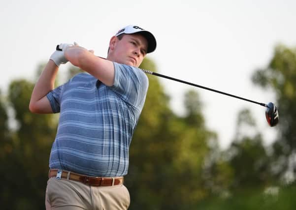 Bob MacIntyre tees off at the third on his way to a two-under 70 in the opening round of the Abu Dhabi HSBC Championship. Picture: Ross Kinnaird/Getty Inages