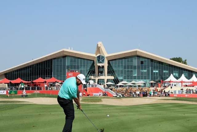 Shane Lowry of Ireland plays his second shot on the ninth hole in front of the iconic clubhouse at Abu Dhabi Golf Club. Picture: Andrew Redington/Getty