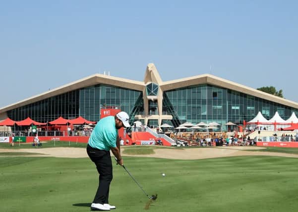 Shane Lowry of Ireland plays his second shot on the ninth hole in front of the iconic clubhouse at Abu Dhabi Golf Club. Picture: Andrew Redington/Getty