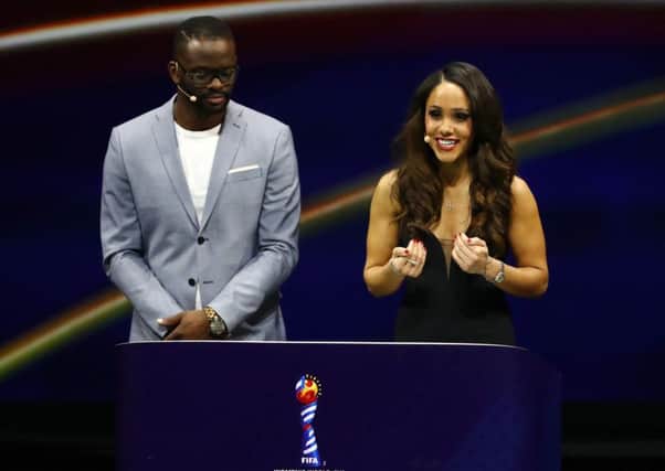 Football presenter Alex Scott, seen with Louis Saha at the Women's World Cup draw, may be boring, but so are her male colleagues in the studio (Picture: Dean Mouhtaropoulos/Getty Images)