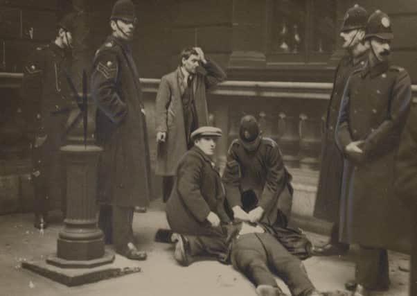 David Kirkwood, later an MP, lies prone after being hit by police, while future Communist MP Willie Gallacher is arrested (Picture: National Library of Scotland)