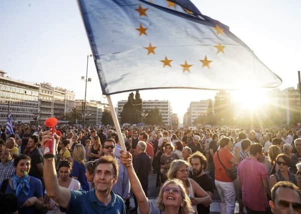 Pro-European Union protesters take part in a rally in front of the Greek parliament. Picture: Milos Bicanski/Getty Images