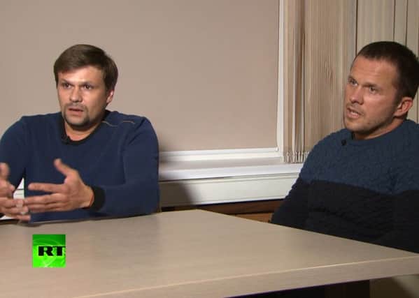 Ruslan Boshirov, left, and Alexander Petrov appeared in an interview with the Kremlin-funded RT channel in Moscow, Russia in September last year. Picture: RT via AP