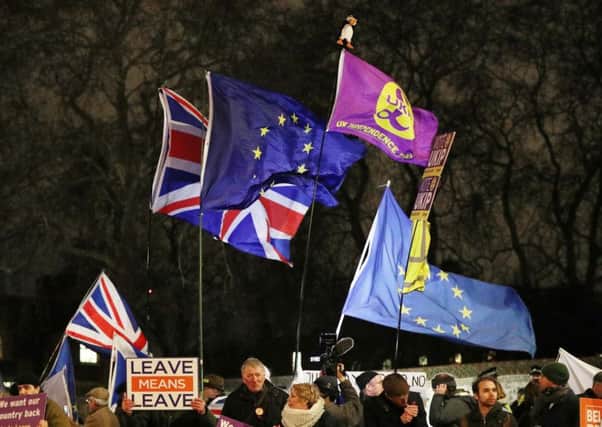 Protesters outside the House of Commons in London as MPs debate the Prime Minister's Brexit deal. Picture: Jonathan Brady/PA Wire