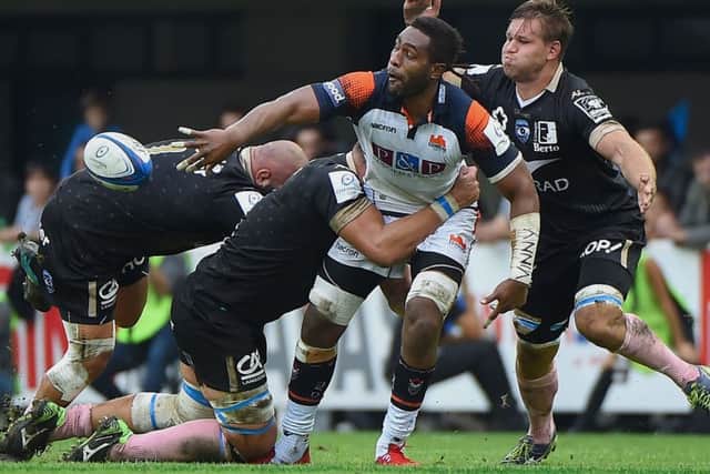 Viliame Mata offloads the ball during Edinburghs defeat by Montpellier in the Pool 5 opener. Picture: AFP/Getty
