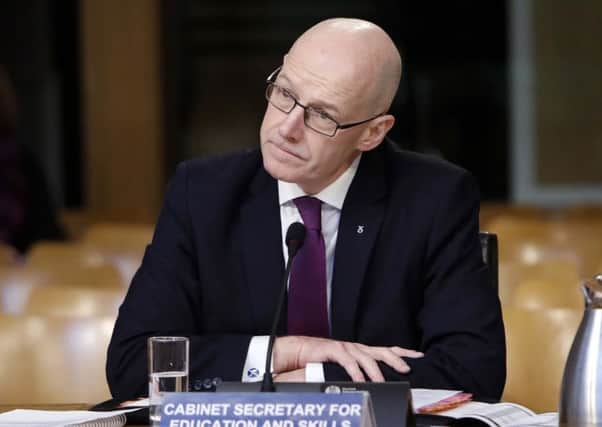 An independent panel tasked with devising a 'code of practice' to address concerns over information sharing has told Deputy First Minister John Swinney it is struggling to do this. Picture: Andrew Cowan