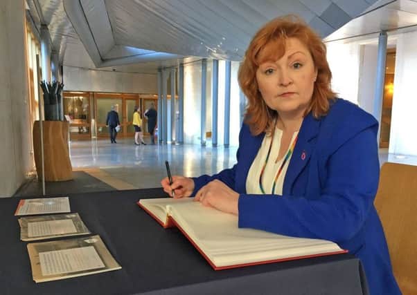 South of Scotland MSP Emma Harper signs Holyroods Holocaust Remembrance book