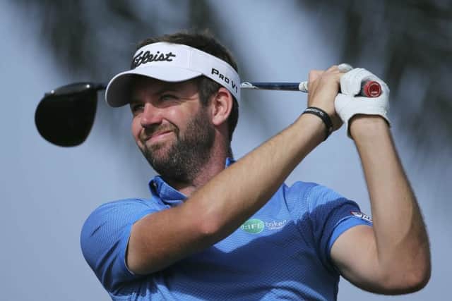 Scott Jamieson tees off on the 11th hole in the third round of the Abu Dhabi HSBC Championship. Picture: Getty Images