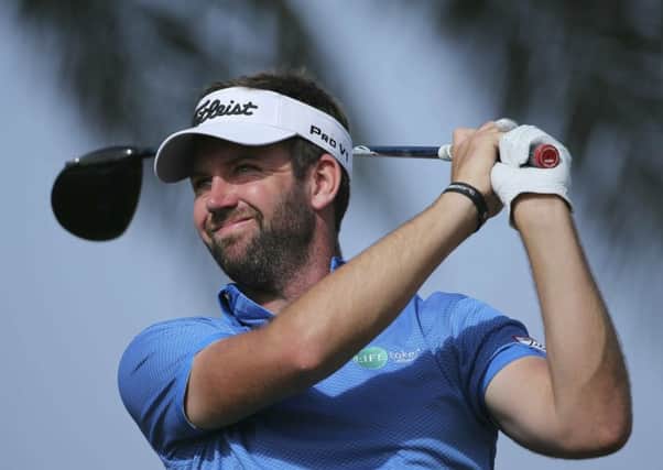 Scott Jamieson tees off on the 11th hole in the third round of the Abu Dhabi HSBC Championship. Picture: Getty Images