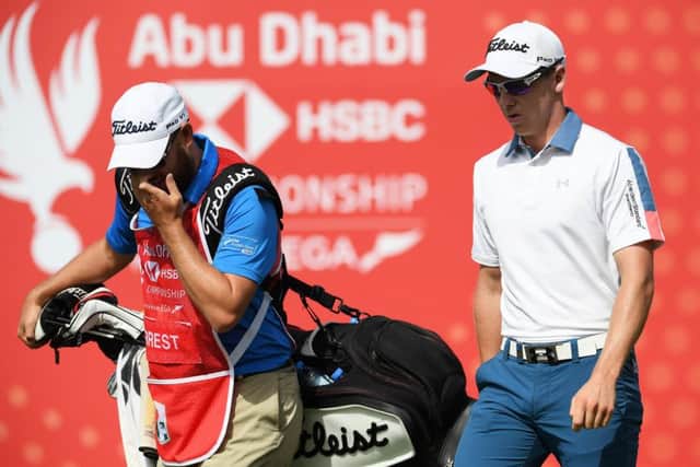 Grant Forrest walks off the first tee with his caddie Scott Carmichael at Abu Dhabi Golf Club. Picture: Getty Images