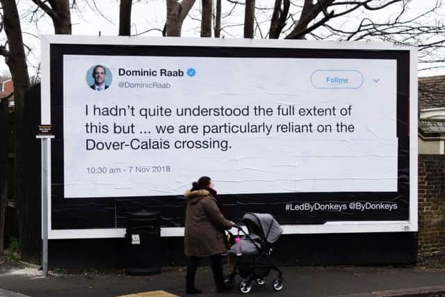 One of the billboard posters which has been stuck up in Dover reminding politicians of their old tweets. Picture: SWNS