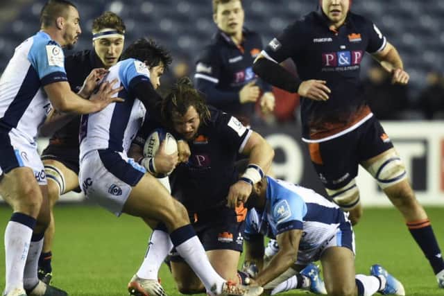 Edinburghs Pierre Schoeman takes on Montpelliers defence. Picture: SNS/SRU