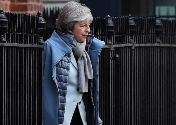 Prime Minister Theresa May leaves from the rear of 10 Downing Street on Friday. Picture: Ben StansallAFP/Getty Images