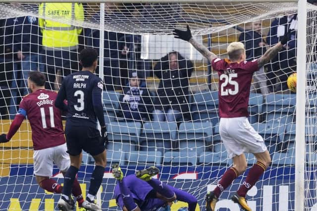 Stephen Dobbie opens the scoring for Queen of the South. Pic: SNS/Alan Rennie
