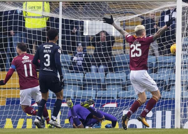 Stephen Dobbie opens the scoring for Queen of the South. Pic: SNS/Alan Rennie
