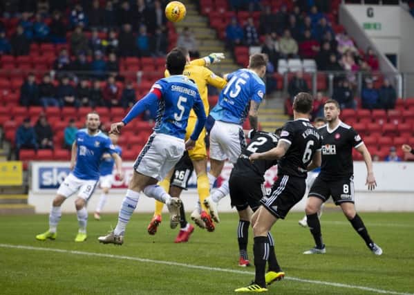 St Johnstone defender Jason Kerr beats Hamilton keeper Ryan Fulton to the ball to give the home side an early lead. Pic: SNS/Kenny Smith