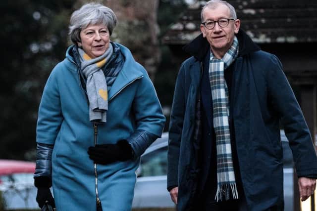Theresa May and her husband Philip May attend a Sunday church service yesterday in Aylesbury. A group of MPs are expected to present a bill on Monday which could allow Brexit to be delayed if Parliament does not approve an EU withdrawal agreement. Picture: Getty