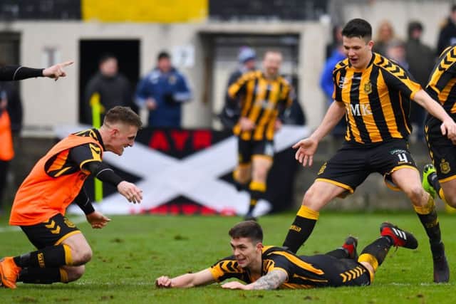 Craig McCracken celebrates after his goal gives Talbot the lead and a place in the fifth round of the Cup. Picture: SNS