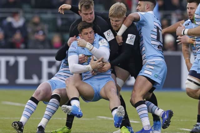 DTH van der Merwe of Glasgow is tackled by Nick Tompkins, left, and Jackson Wray of Saracens at Allianz Park. Picture: Henry Browne/Getty