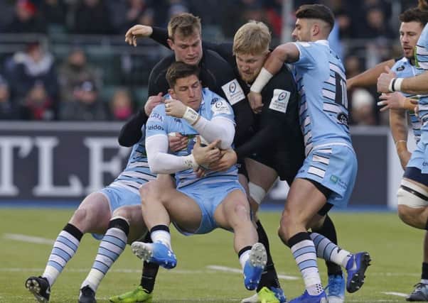 DTH van der Merwe of Glasgow is tackled by Nick Tompkins, left, and Jackson Wray of Saracens at Allianz Park. Picture: Henry Browne/Getty