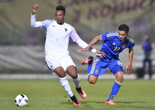 Maryan Shved vies for the ball with France's Jean-Phillipe Gbamin during a UEFA Euro 2017 U21 Championship qualifier. Picture: Getty Images