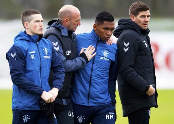 Alfedo Morelos with, left, Gary McAllister and Steven Gerrard. Picture: Craig Williamson/SNS