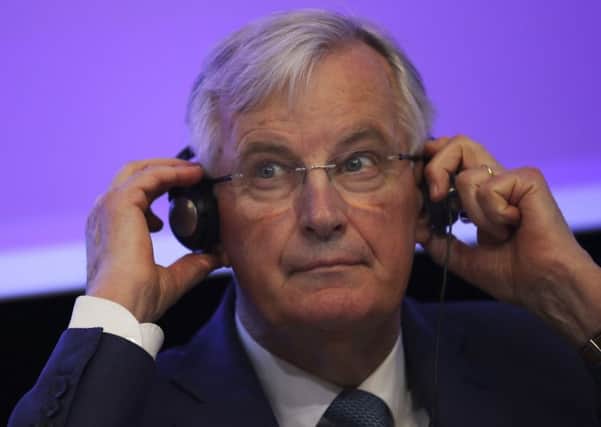 European Union chief Brexit negotiator Michel Barnier adjusts his headphones during a debate on Brexit at the Charlemagne building in Brussels. Picture: AP Photo/Francisco Seco