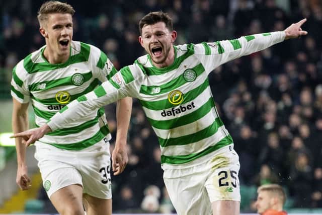 Oli Burke celebrates scoring the opener with Kristoffer Ajer. Picture: SNS Group