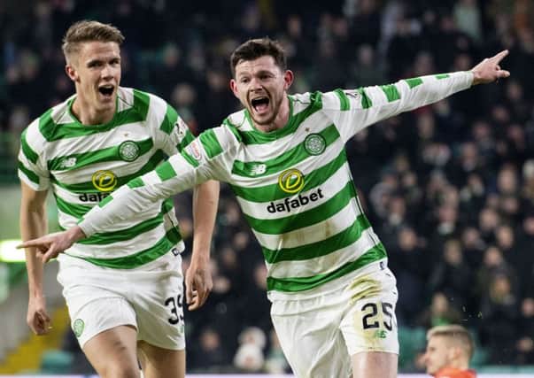 Oli Burke celebrates scoring the opener with Kristoffer Ajer. Picture: SNS Group