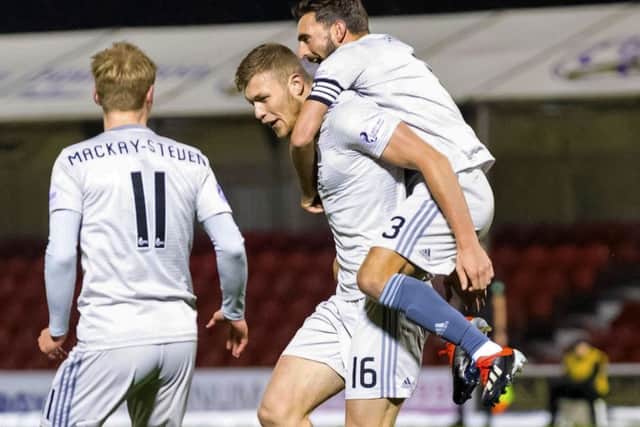 Aberdeen's Sam Cosgrove, centre, celebrates his opener against Hamilton. Picture: Roddy Scott/SNS