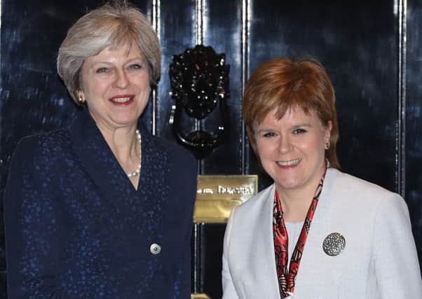Nicola Sturgeon and Theresa May on the steps of 10 Downing Street in 2017 (Picture: Dan Kitwood/Getty)