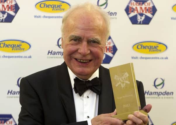 Hugh McIlvanney celebrates after being inducted into the Scottish Football Hall of Fame in 2011. Picture: SNS